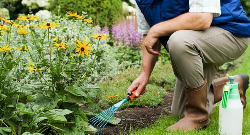 Outdoor garden design features in Aldborough Hatch with patio and shrubs